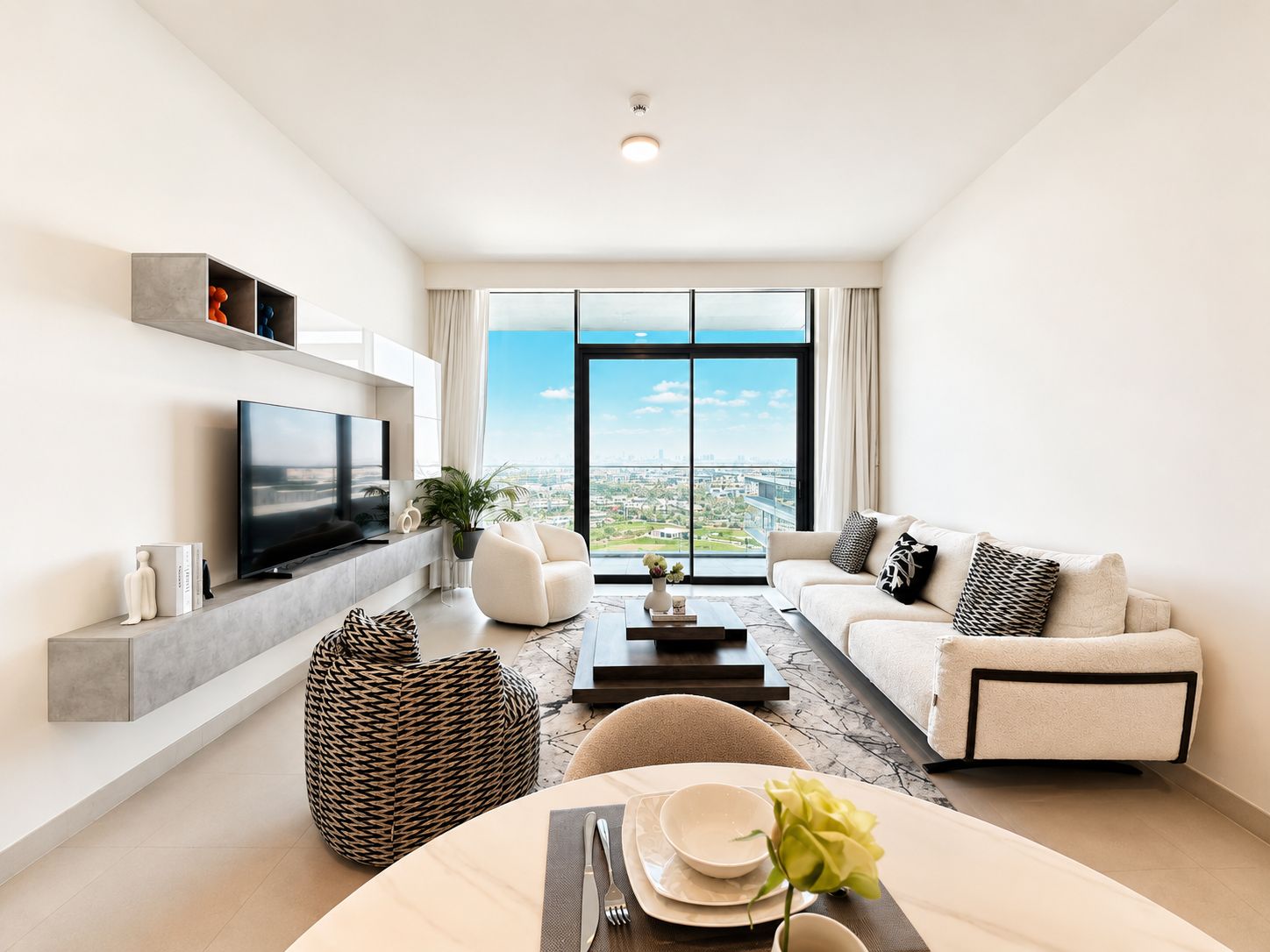 Staged Dubai living room with bouclé sofa and panoramic view