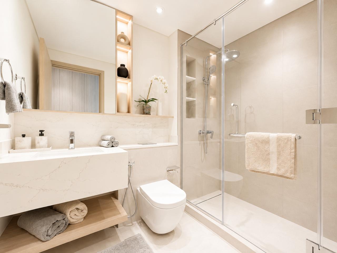 Composed Dubai bathroom with marble vanity and warm lighting
