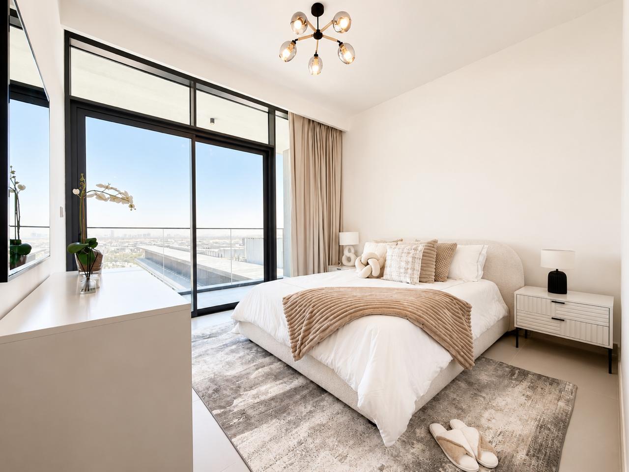 Staged Dubai bedroom in soft neutrals with city view